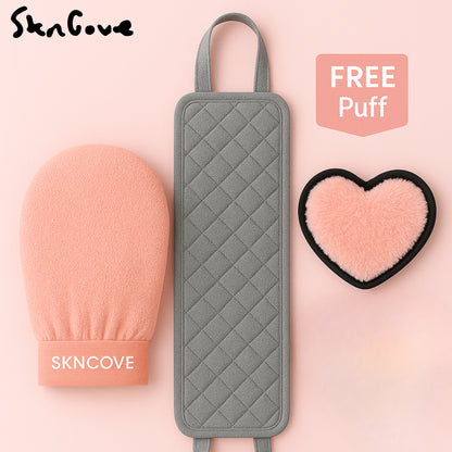 Three skincare tools including a pink mitt, gray scrubber, and heart-shaped puff on a pink background with 'SKNCOVE' branding.