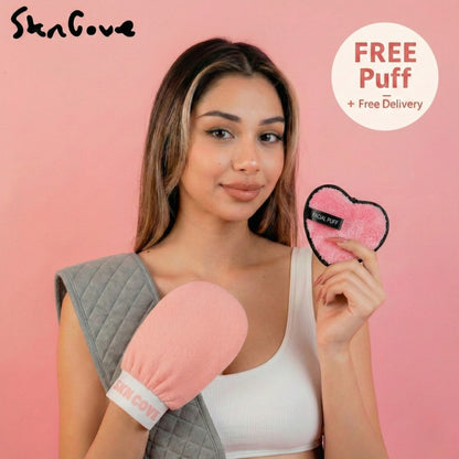 Woman holding a pink and gray skin care tool with a free puff offer on a pink background.