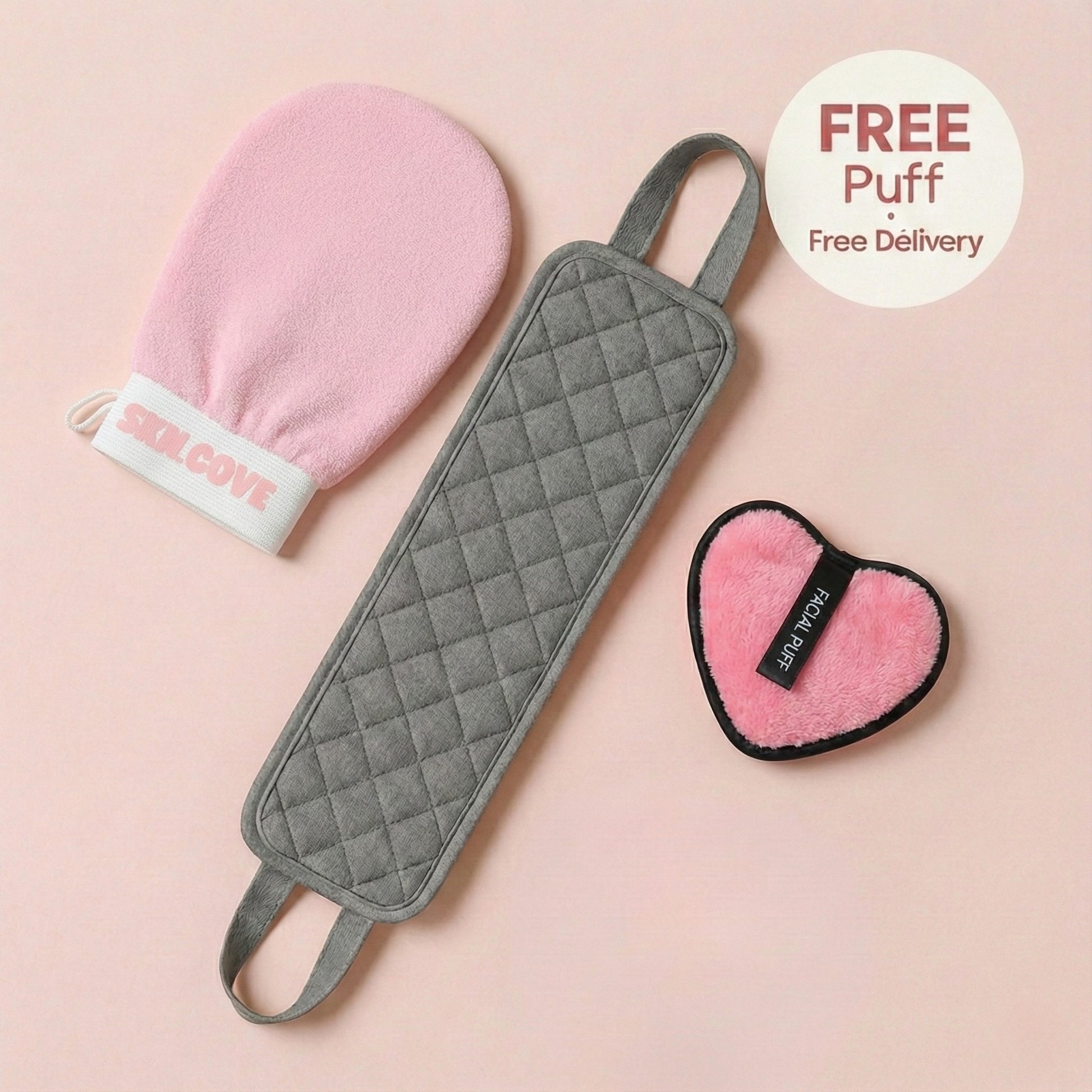 Gray scrubber, pink mitt, and heart-shaped puff on a pink background with 'Red Cow' branding.