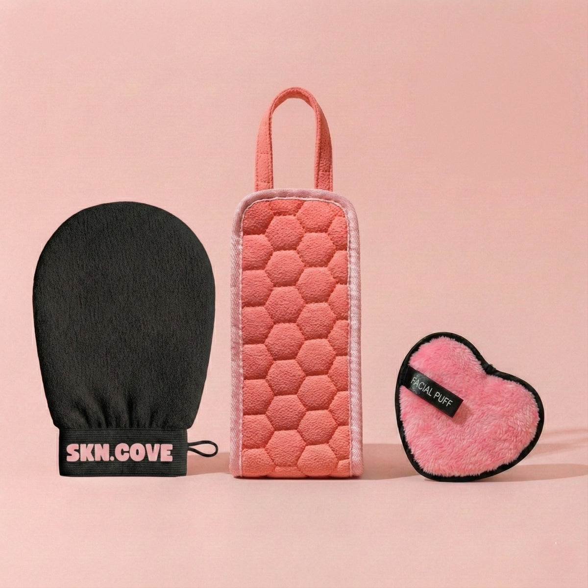 SknCove Full Body Glow Kit with the black exfoliating glove, back scrubber belt and heart puff